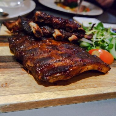 Spareribs on the cutting board in the restaurant.